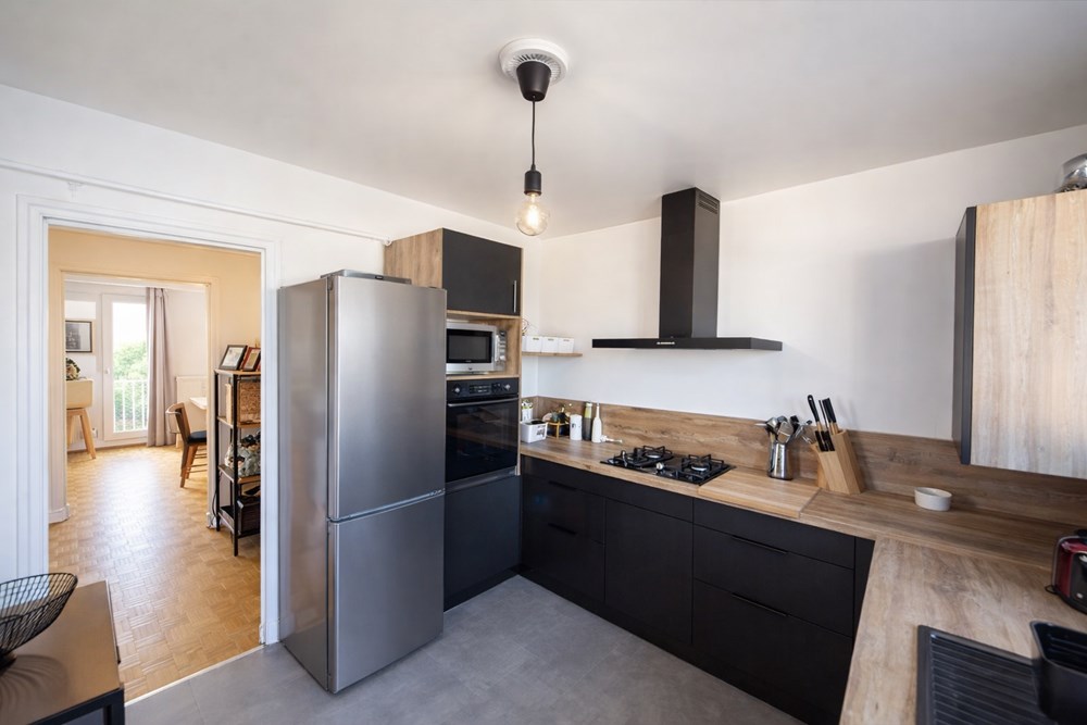 APPARTEMENT 65M² - SANS TRAVAUX - DERNIER ETAGE - 2 CHAMBRES - CAVE - GARAGE - PROCHE COMMERCES photo 3