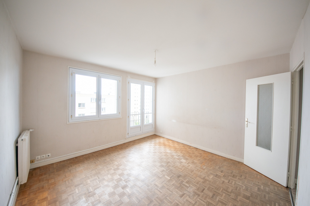 APPARTEMENT 60M² - DEUX CHAMBRES - ASCENSEUR - RESEAU DE CHALEUR URBAIN - BALCON - GARAGE photo 3