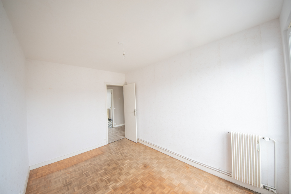 APPARTEMENT 60M² - DEUX CHAMBRES - ASCENSEUR - RESEAU DE CHALEUR URBAIN - BALCON - GARAGE photo 5